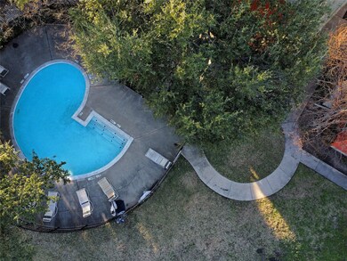View of community swimming pool featuring a patio 