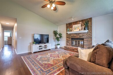 Living room features vaulted ceiling, and gas fire