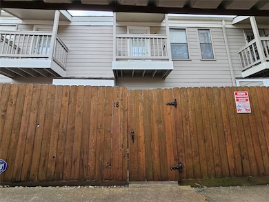 Access home through gated rare entrance at carport