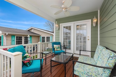 Deck with an outdoor living space and ceiling fan