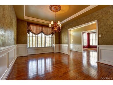 Formal dinning room with bay window.
