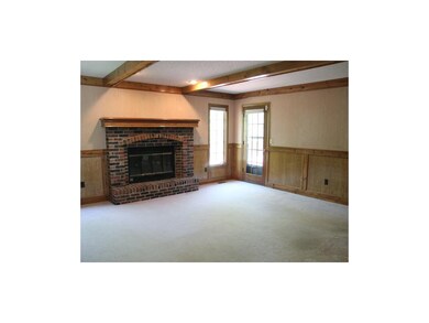 Generous family room with fireplacee opens to expa