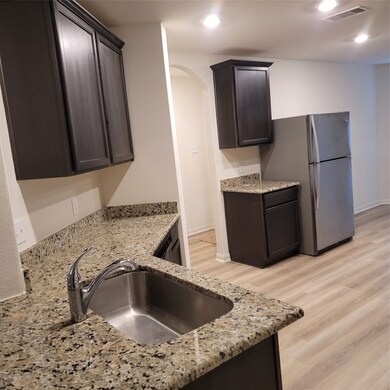 Kitchen counter tops and stainless refrigerator