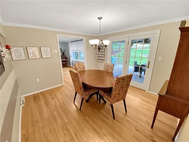 The dining room also features crown moldings and h