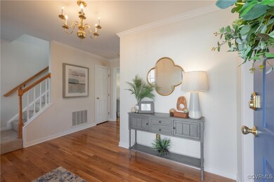 Entryway featuring stairway, wood finished floors,
