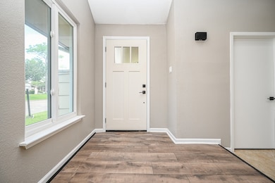 This is a clean and bright entryway featuring a mo