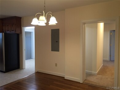 Dining area.  The opening to the left goes to the laundry room.  The opening to the right goes to the bedrooms.