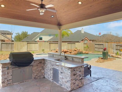 Outdoor kitchen under large covered patio