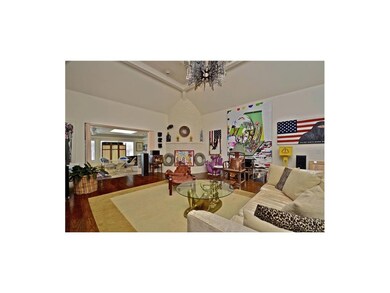 Gas fireplace is brick and built with a rounded fo