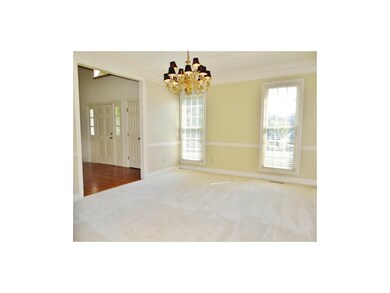 The formal dining room is adjacent to the entryway