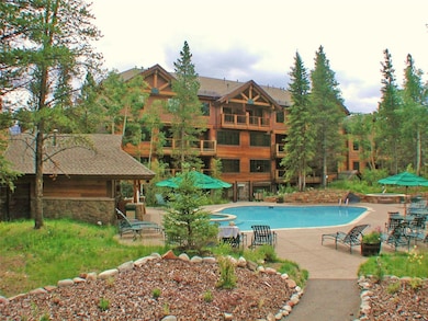 Community pool with a patio