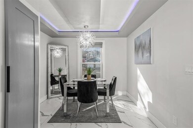 Gorgeous dining area with custom cove lighting.
