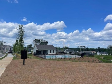 View of property's community featuring fence and a