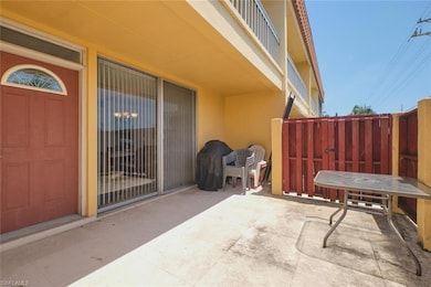 View of patio / terrace with fence and a gate