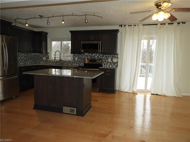Eating area has slider to large rear deck and full
