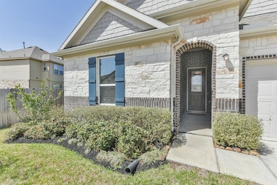 The house has an inviting walkway and is set in a