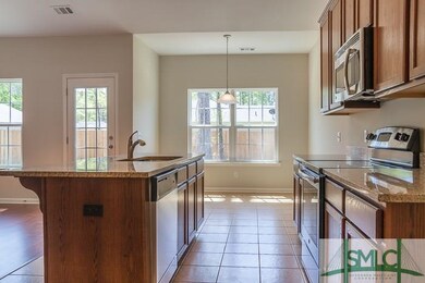 Upgraded kitchen with granite countertops, stainle