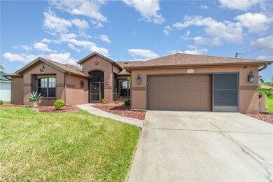 View of front of home with stucco siding, concrete driveway, a garage, and a front lawn