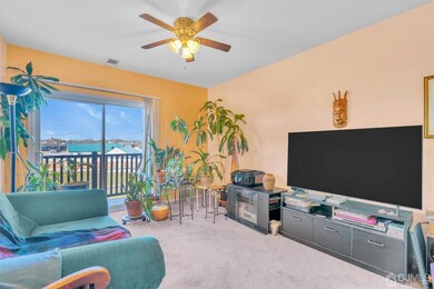 Living Room w/ Balcony Access
