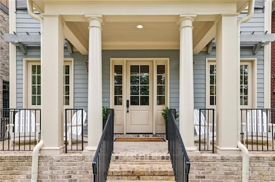 Property entrance with covered porch