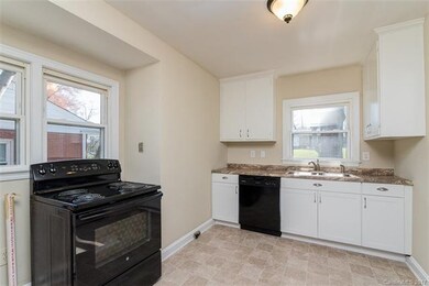 Kitchen has new appliances, fresh paint, new floor
