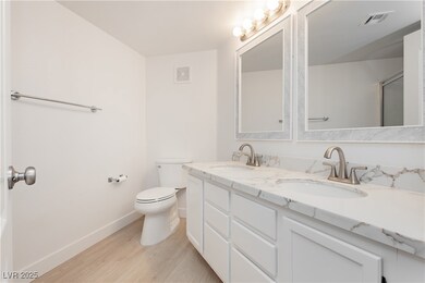 New mirrors, flooring, toilet, sinks, faucets, baseboard,