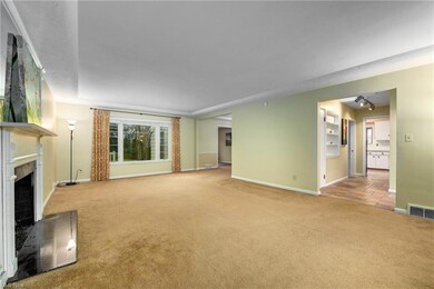 This view is facing the back of the house. The front foyer to the right includes a 1/2 bath. The door closest to the kitchen goes to the finished basement and the door to the left of it takes you to a walk up attic.