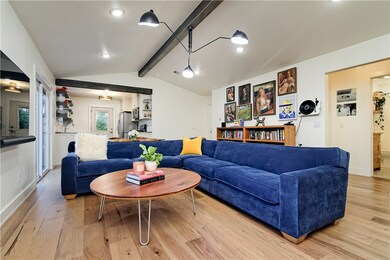 Open living area flows into the kitchen.