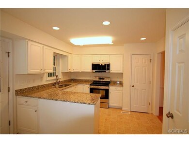 The kitchen offers tons of cabinet and pantry stor