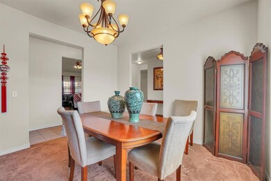 Dining space with carpet flooring and a notable ch