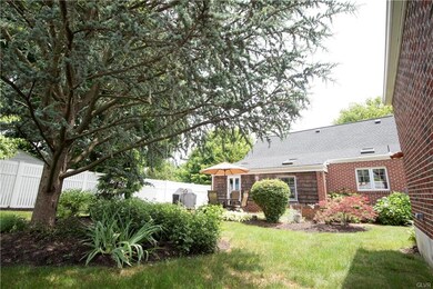 FULLY-FENCED BACKYARD W/BRICK PATIO