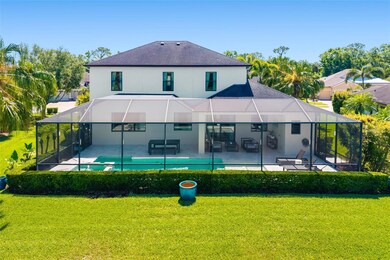 Fully Screened Lanai Surrounded by Lush Tropical Landscaping