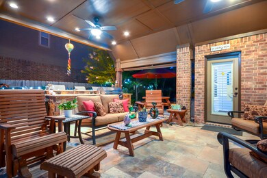 This Texas Size patio has a summer kitchen and lots of space for multiple seating areas.