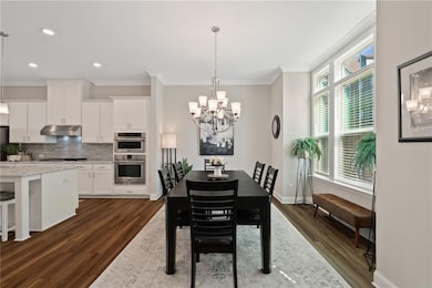 Dining room with bay window to the right.