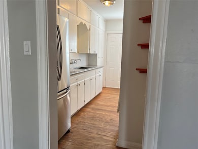 Adorable, vintage kitchen with large, stainless re