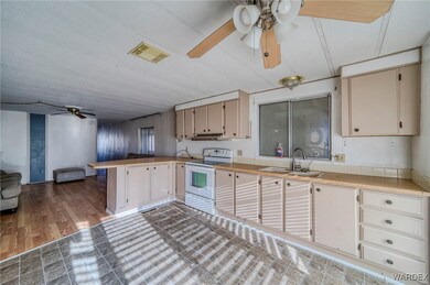Kitchen with dark hardwood / wood-style floors, wh