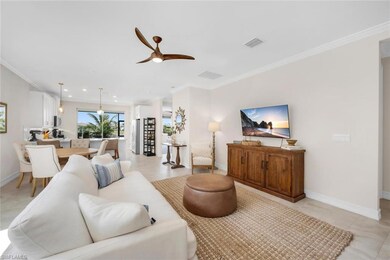 Living room with visible vents, ornamental molding