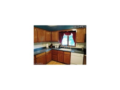 Kitchen with corian counter top and Oak cabinets
