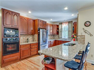 Kitchen updated with granite counters and tile bac