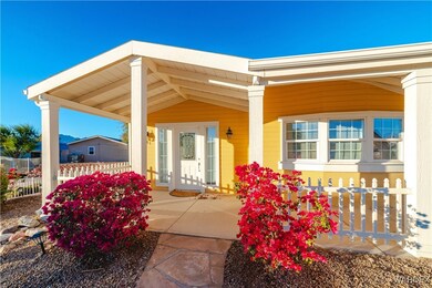 View of exterior entry featuring covered porch