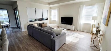 Living room with hardwood / wood-style flooring