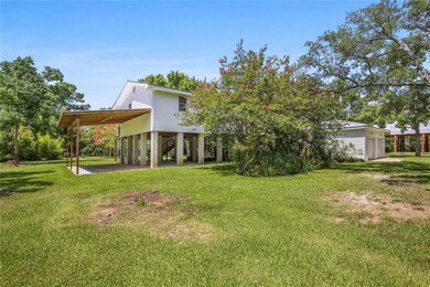 View from Lucille Drive Raised - Move In Condition with $7K Lift - Excellent Condition 3 Bedroom. Added RV or Boat Parking to the Left.  Lot adjoining For Sale and across the water way 2nd Lot For Sale also