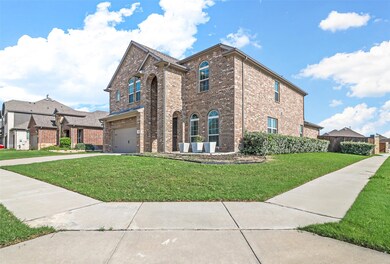 View of front facade with a front yard and a garage