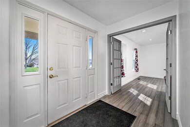 Entry Foyer w/french doors leading to BONUS room t