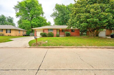 Single story home featuring a garage and a front l