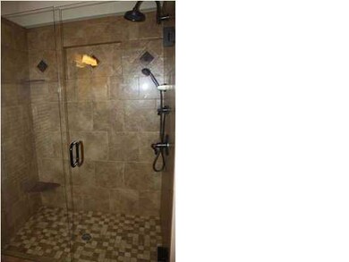 Large master suite with entry to covered deck.