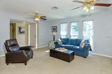 Living Room Area Features Double Ceiling Fans to K