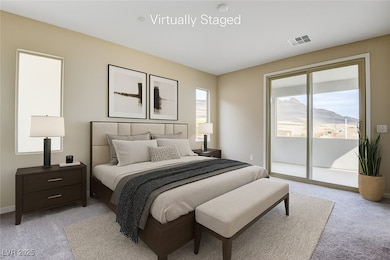Bedroom with light carpet and access to outside ba