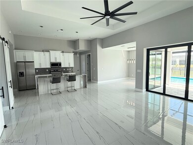 Kitchen with appliances with stainless steel finis