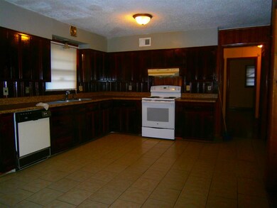 Large Open Eat-in Kitchen has ceramic tile floors.
